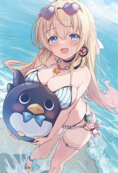 1girl :d beach bikini blonde_hair blue_bikini blue_eyes blush breasts charm_(object) cleavage commentary_request cutlass_(classic_chocolate) day eyewear_on_head foot_out_of_frame hair_between_eyes hair_ribbon halterneck heart heart-shaped_eyewear highres large_breasts long_hair looking_at_viewer noya_(stella_sora) ocean open_mouth outdoors ribbon sandals skindentation smile solo standing stella_sora striped_bikini striped_clothes sunglasses swimsuit thigh_strap water white_ribbon