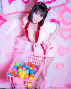 1girl ball breasts brown_eyes brown_hair collar fake_horns female_focus highres holding horns large_breasts looking_at_viewer medium_hair model photo_(medium) real_life shibuya_kaho shopping_cart smile solo