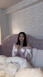 1girl animated asian bed bed_sheet black_hair breasts convenient_censoring hair_censor hair_over_breasts highres indoors long_hair looking_at_viewer medium_breasts on_bed open_clothes parted_lips pillow real_life saotome_kana smile solo sound tagme teasing teeth video