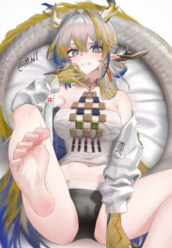 1girl absurdres alternate_breast_size arknights bare_shoulders barefoot blonde_hair blue_eyes clenched_teeth feet foot_focus grey_hair hair_intakes highres horns jewelry long_hair long_sleeves looking_at_viewer midriff mildt navel necklace off_shoulder pointy_ears shu_(arknights) soles solo strapless teeth toes tube_top very_long_hair