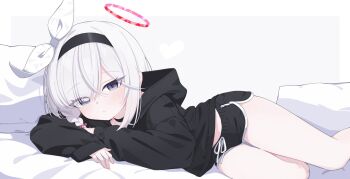 1girl alternate_costume black_choker black_hairband black_hoodie black_shorts blue_archive bow braid choker cinamon_(cinamori) closed_mouth dolphin_shorts expressionless eyes_visible_through_hair foot_out_of_frame grey_eyes hair_between_eyes hair_bow hair_over_one_eye hair_ribbon hairband halo hashtag-only_commentary highres hood hoodie light_blush loli long_bangs long_hair long_sleeves looking_at_viewer lying on_bed on_side parted_bangs pillow plana_(blue_archive) red_halo ribbon short_shorts shorts side_braid simple_background single_braid sleeves_past_wrists solo thigh_gap thighs tilted_halo white_background white_bow white_hair white_ribbon