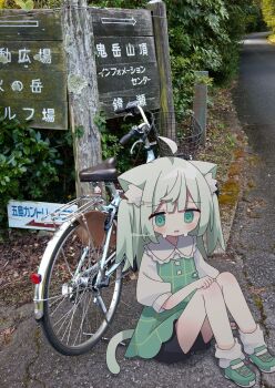 1girl ahoge animal_ear_fluff animal_ears bicycle black_shorts cat_ears cat_girl cat_tail commentary dress highres nakkar original photo_background shirt shoes short_sleeves shorts socks solo symbol-only_commentary tail white_shirt white_socks