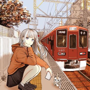 1boy 1girl autumn black_skirt building cat commentary_request day hankyu_corporation highres hood hoodie loafers long_hair looking_at_viewer multiple_unit_train orange_hoodie original outdoors overhead_line railroad_tracks shoes skirt socks solo_focus squatting tanuuuuu3 train train_conductor train_station train_station_platform white_hair white_socks