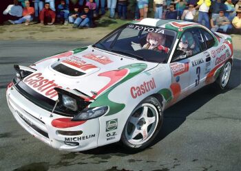 2girls alternate_costume aqua_eyes aqua_hair blue_eyes car closed_mouth commentary double-parted_bangs driving english_commentary gloves hair_between_eyes hatsune_miku headset megurine_luka motor_vehicle multiple_girls notes open_mouth outdoors photorealistic pink_hair pop-up_headlights race_vehicle racecar rally_car reading realistic red_gloves road seatbelt serious short_hair sponsor steering_wheel takepon1123 toyota toyota_celica twintails vehicle_focus vocaloid wheel white_car white_racing_suit windshield wipers