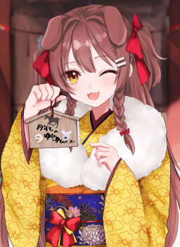 1girl absurdres animal_ears bone_hair_ornament bow braid brown_hair chinese_zodiac commentary_request dog_ears dog_girl ema floral_print floral_print_kimono fur-trimmed_kimono fur_trim hair_between_eyes hair_bow hair_ornament hand_on_own_hip highres holding holding_ema hololive inugami_korone japanese_clothes kimono long_sleeves looking_at_viewer misaki_emiru obi one_eye_closed open_mouth orange_eyes print_kimono red_bow sash smile solo twin_braids wide_sleeves year_of_the_horse yellow_kimono