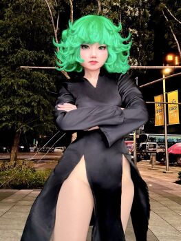 1girl black_hair breasts cosplay crossed_arms green_eyes green_hair highres looking_at_viewer neneko0814 night no_panties one-punch_man outdoors photo_(medium) real_life tatsumaki tatsumaki_(cosplay)