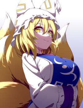 1girl animal_hat arms_under_breasts blonde_hair blue_tabard breasts closed_mouth commentary_request crossed_arms fox_tail hat hiro_(pqtks113) kitsune large_breasts long_sleeves looking_at_viewer mob_cap multiple_tails smile solo tabard tail touhou wide_sleeves yakumo_ran yellow_eyes