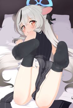 1girl black_hair black_socks blue_archive blue_halo commentary_request didac_fantasy dress from_behind grey_hair halo highres kokona_(blue_archive) long_hair looking_at_viewer looking_back lying multicolored_hair no_shoes on_stomach orange_eyes pelvic_curtain sleeveless sleeveless_dress socks soles solo streaked_hair tagme