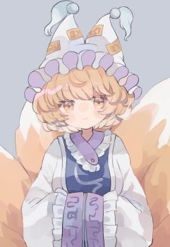 1girl blonde_hair blue_tabard closed_mouth commentary dress fox_tail grey_background hands_in_opposite_sleeves hat hiyuu_(hiyualice) long_sleeves looking_at_viewer mob_cap multiple_tails short_hair smile solo tabard tail touhou upper_body white_dress white_hat wide_sleeves yakumo_ran