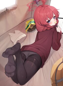 1girl 2drr ahoge ass backpack bag bag_of_chips beanie black_pantyhose blue_archive blue_eyes blush braid brown_hat brown_sweater chips_(food) commentary_request day drawing_tablet feet female_focus food food_in_mouth from_behind full_body hair_over_shoulder halo hat highres holding holding_stylus long_hair looking_at_viewer looking_back lying maki_(blue_archive) mouth_hold on_stomach panties panties_under_pantyhose pantyhose red_hair soles solo stylus sunlight sweater thighband_pantyhose underwear unworn_hat unworn_headwear white_panties