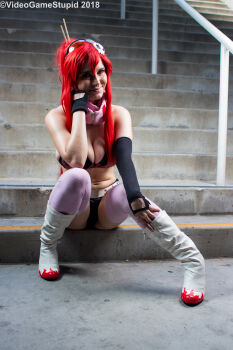 1girl asymmetrical_gloves beccadex belt bikini bikini_top_only breasts cleavage cosplay_photo elbow_gloves fingerless_gloves flame_print gloves hair_ornament hair_stick high_ponytail large_breasts leather_shorts long_sidelocks navel no_shirt nose_piercing nose_ring photo_(medium) piercing pink_scarf pink_thighhighs ponytail real_life red_hair scarf short_shorts shorts sidelocks single_elbow_glove skull_hair_ornament solo stairs stairwell studded_belt sunglasses tengen_toppa_gurren_lagann thighhighs uneven_gloves yoko_littner yoko_littner_(cosplay)