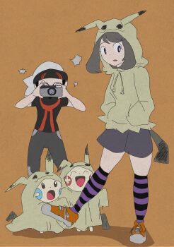 1boy 1girl absurdres alternate_costume animal_ears artist_name black_hair black_jacket black_skirt blue_eyes blush brendan_(pokemon) brown_background brown_hair camera camera_flash camera_lens child closed_eyes cosplay covering_face fake_animal_ears fake_tail fang full_body gen_3_pokemon gen_7_pokemon hands_in_pockets happy hat height_difference highres holding hood hoodie jacket legs looking_to_the_side may_(pokemon) medium_hair mimikyu mimikyu_(cosplay) minun nintendo object open_mouth plusle pokemon pokemon_adventures purple_legwear red_eyes red_footwear shoes short_sleeves shorts shy simple_background size_difference skirt sneakers socks standing striped_legwear surprised tail taking_picture thighs traditional_media yellow_jacket