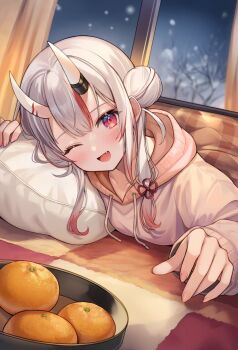 1girl ;d alternate_costume aria_(ariacue) center-flap_bangs commentary_request double_bun fang fingernails food fruit gradient_hair grey_hair hair_between_horns hair_bun highres hololive hood hoodie horns indoors kotatsu long_hair looking_at_viewer lying mandarin_orange multicolored_hair nakiri_ayame on_stomach one_eye_closed oni open_mouth red_eyes red_hair skin-covered_horns smile snowing solo streaked_hair table two_side_up under_kotatsu under_table virtual_youtuber white_hoodie