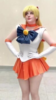 1girl aino_minako animated bishoujo_senshi_sailor_moon blonde_hair blue_eyes bow breasts dancing earrings gloves hands_on_own_hips jewelry large_breasts long_hair looking_at_viewer miniskirt red_bow sailor_venus sailor_venus_(cosplay) san_chan_claudia short_sleeves skirt sound tagme very_long_hair video