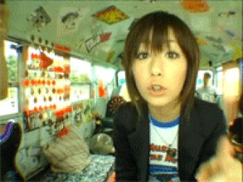 Rule 34 | 1girl, animated, animated gif, asian, black hair, j-pop, jewelry, kimura kaela, lowres, nail polish, necklace, off-topic, photo (medium), pointing, rolling eyes, short hair, train, train interior