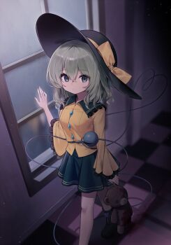 1girl black_hat buttons closed_mouth collared_shirt diamond_button green_eyes green_hair green_skirt hair_between_eyes hat hat_ribbon heart heart_of_string highres komeiji_koishi long_sleeves pudding_(skymint_028) ribbon shirt short_hair skirt solo stuffed_animal stuffed_toy teddy_bear third_eye touhou window yellow_ribbon yellow_shirt