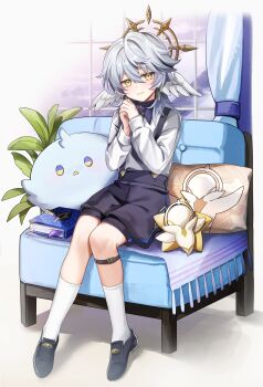1boy absurdres aged_down alternate_costume asada_sadao blue_hair book commentary_request couch full_body halo halo_behind_head head_wings highres honkai:_star_rail honkai_(series) indoors leg_belt light_smile long_sleeves medium_hair pillow plant shirt shoes shorts socks stuffed_toy sunday_(honkai:_star_rail) wings yellow_eyes