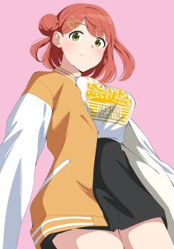 1girl absurdres black_skirt braid breasts bun_with_braided_base clothes_writing commentary cowboy_shot green_eyes hair_bun highres jacket large_breasts letterman_jacket looking_at_viewer love_live! love_live!_fan_fun_festival love_live!_nijigasaki_high_school_idol_club medium_hair miniskirt open_clothes open_jacket orange_hair pink_background shirt simple_background single_side_bun skirt solo standing uchuu_no_mozuku uehara_ayumu white_shirt yellow_jacket
