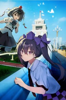 2girls black_hair black_necktie black_skirt blue_sky bow brown_hair camera checkered_clothes checkered_skirt china closed_mouth collared_shirt commentary_request expressionless feet_out_of_frame hair_between_eyes hair_bow hat highres himekaidou_hatate holding holding_camera iwakoo long_hair looking_at_viewer multiple_girls necktie one_eye_closed open_mouth outdoors pointy_ears pom_pom_(clothes) purple_bow purple_eyes purple_hat purple_skirt real_world_location red_eyes red_hat shameimaru_aya shirt short_sleeves skirt sky smile taiyuan tokin_hat touhou twintails white_shirt