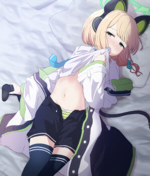 1girl animal_ear_headphones animal_ears bed_sheet black_shorts black_thighhighs blonde_hair blue_archive blue_necktie blush bow bow_panties breasts buttons cat_ear_headphones cat_ears cat_tail clenched_hand clothes_lift collared_shirt commentary_request controller dot_nose fake_animal_ears fake_tail feet_out_of_frame game_controller green_bow green_eyes green_halo green_jacket green_panties hair_bow half-closed_eyes halo hand_up headphones highres holding holding_controller holding_game_controller jacket kaine_(gupisgood) lifting_own_clothes loli long_sleeves looking_at_viewer looking_to_the_side low-tied_sidelocks lying midori_(blue_archive) mouth_hold multicolored_jacket navel necktie nose_blush off_shoulder on_back open_clothes open_fly open_jacket open_shorts panties pillow shadow shirt shirt_lift short_hair short_shorts shorts sidelocks small_breasts solo stomach striped_clothes striped_panties swept_bangs tail tareme thighhighs underwear white_jacket white_shirt wide_sleeves