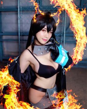 1girl black_bra bra breasts cosplay en'en_no_shouboutai female_focus fire highres large_breasts long_hair looking_at_viewer model partially_undressed photo_(medium) shibuya_kaho smile solo tamaki_kotatsu tamaki_kotatsu_(cosplay) twintails underwear wig