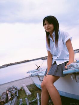 Rule 34 | 1girl, asian, bare legs, boat, dutch angle, female focus, kawamura yuki, long hair, looking at viewer, ocean, outdoors, photo (medium), pleated skirt, skirt, solo, tagme, watercraft