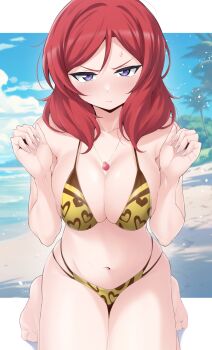1girl beach bikini blue_sky breasts brown_bikini closed_mouth cloud commentary_request day highres jewelry kirisaki_reina large_breasts looking_at_viewer love_live! medium_hair multicolored_bikini necklace nishikino_maki ocean outdoors red_hair sky solo swimsuit two-tone_bikini yellow_bikini