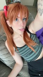 Rule 34 | 1girl, arm tattoo, blue eyes, brazilian (nationality), breasts, brown hair, casual, cosplay, hairpods, highres, interface headset, lips, looking at viewer, memepantazis, neon genesis evangelion, photo (medium), selfie, solo, souryuu asuka langley, souryuu asuka langley (cosplay), standing, tattoo, tongue, tongue out, twintails, two side up