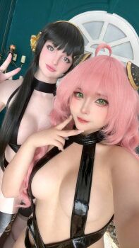 2girls absurdres aged_up anya_(spy_x_family) ass black_hair breasts cosplay couch evie_lee_mikomin hair_ornament headband high_heels highres large_breasts leggings long_hair looking_at_viewer multiple_girls photo_(medium) pink_hair real_life sayo_momo spy_x_family teasing yor_briar