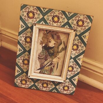 Rule 34 | 1girl, acrylic paint (medium), beret, blonde hair, braid, brown eyes, brown hair, cactus, closed mouth, commentary request, expressionless, flower, hat, highres, holding, holding flower, indoors, japanese clothes, karintoun, kimono, looking at viewer, medium hair, muted color, original, painting (medium), patchwork, photo (medium), picture frame, plant, portrait, scarf, short hair, sidelocks, signature, simple background, straight-on, traditional media, upper body, watercolor (medium)