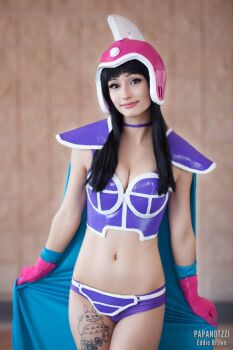 1girl armor bikini bikini_armor black_hair blue_bikini blue_cape breasts brown_eyes cape chi-chi_(dragon_ball) chi-chi_(dragon_ball)_(cosplay) cleavage closed_mouth cosplay cosplay_photo dragon_ball dragon_ball_(classic) female_focus gloves helmet highres kouhai_kiyoko long_hair looking_at_viewer navel photo_(medium) pink_gloves pink_helmet real_life smile solo swimsuit