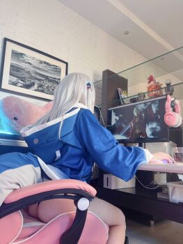 1girl ass black_panties chair computer cosplay female_focus gaming_chair gawr_gura gawr_gura_(cosplay) headphones highres hololive hololive_english long_hair looking_back computer_mouse panties ravvcoser real_life solo stuffed_toy swivel_chair underwear virtual_youtuber white_hair