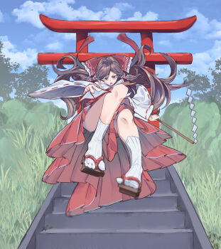 1girl ascot between_fingers bow brown_eyes brown_hair cloud cloudy_sky detached_sleeves frilled_bow frilled_hair_tubes frills geta gohei grass hair_bow hair_tubes hakurei_reimu hat highres holding holding_gohei kanaria_(bcomn) long_hair nontraditional_miko ofuda ofuda_between_fingers open_mouth red_bow red_skirt ribbon ribbon-trimmed_sleeves ribbon_trim shirt skirt skirt_set sky socks solo stairs torii touhou tree yellow_ascot