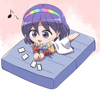 1girl :3 :d ability_card_(touhou) barefoot blush cape chibi chibi_only commentary_request dress full_body hairband long_sleeves lying mattress multicolored_dress multicolored_hairband on_stomach open_mouth patchwork_clothes purple_eyes purple_hair rainbow_gradient rokugou_daisuke short_hair signature smile solo tenkyuu_chimata touhou white_cape