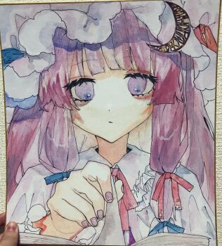 1girl blue_bow blunt_bangs book bow commentary_request crescent crescent_hat_ornament dress fingernails hair_bow hat hat_ornament highres long_hair looking_at_viewer mob_cap multiple_hair_bows open_mouth patchouli_knowledge purple_eyes purple_hair purple_nails red_bow shikishi shinjitsu_no_kuchi solo touhou upper_body white_dress white_hat