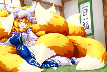 1girl arm_rest blonde_hair blue_tabard breasts fox_girl fox_tail full_body hair_between_eyes hand_on_own_hip hat highres indoors kazami_karasu large_breasts large_tail long_sleeves looking_at_viewer medium_hair mob_cap multiple_tails open_mouth sitting smile solo tabard tail tatami touhou yakumo_ran yellow_eyes yokozuwari