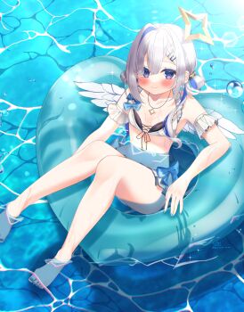 1girl absurdres amane_kanata amane_kanata_(summer) angel angel_wings barefoot blue_hair blush breasts closed_mouth commentary_request grey_hair hair_ornament hairpin halo highres hololive hosimiya_yume looking_at_viewer low_twintails medium_hair official_alternate_costume outdoors purple_eyes small_breasts smile solo star_halo swim_ring twintails virtual_youtuber water wings