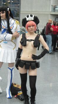 Rule 34 | 1boy, 1girl, belt, black hair, black thighhighs, breasts, chiakifoil, cosplay, crossdressing, epaulettes, hair ornament, hat, holster, jakuzure nonon, jakuzure nonon (cosplay), kill la kill, kiryuuin satsuki, kiryuuin satsuki (cosplay), long hair, looking to the side, mole, navel, nudist beach uniform, photo (medium), pink hair, public indecency, revealing clothes, school uniform, shoes, short hair, skirt, standing, tattoo, thighhighs, topfreedom, topless female, utility belt, white thighhighs, zettai ryouiki