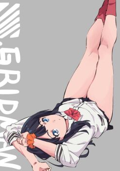 1girl arms_behind_head black_hair black_skirt blue_eyes bow bowtie cardigan commentary_request copyright_name grey_background gridman_universe legs_up long_hair long_sleeves looking_at_viewer lying miniskirt official_art on_back orange_scrunchie pleated_skirt red_bow red_bowtie red_socks saitou_kengo school_uniform scrunchie shirt sidelocks simple_background skirt socks solo ssss.gridman takarada_rikka thick_thighs thighs wrist_scrunchie