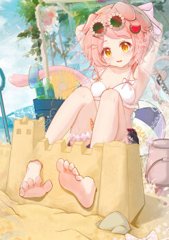 1girl absurdres animal_ears arknights armpits arms_up ball banbanban_li barefoot beach beachball bikini blue_shorts breasts bucket cat_ears cat_girl cat_tail feet flower goldenglow_(arknights) hair_ornament hairclip highres knees_up loli looking_at_viewer outdoors pink_hair sand_castle sand_sculpture shorts shovel soles solo swimsuit tail toes white_bikini yellow_eyes