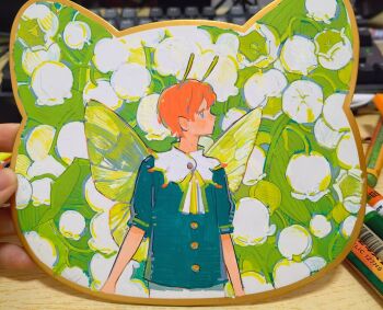 1boy antennae blue_eyes fairy fairy_wings flower green_shirt highres lily_of_the_valley lingcod_dayu looking_to_the_side male_focus nature orange_hair original pants pastel_(medium) photo_(medium) profile shirt traditional_media white_pants wings