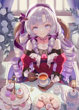 1girl bare_shoulders brown_gloves chair chest_tattoo commentary_request cookie cup cupcake dress drill_hair eyelashes flower food gloves highres hyakumantenbara_salome long_hair looking_at_viewer mitama_(mokochiko) nijisanji on_chair purple_eyes red_dress ringlets rose sitting solo tattoo teacup teapot virtual_youtuber white_flower white_rose