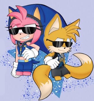 1boy 1girl amy_rose cosplay fan fox grin hedgehog highres medium_hair print_shirt sega shirt shorts sleeveless sleeveless_shirt smile sonic_(series) sonic_the_hedgehog sunglasses tails_(sonic)