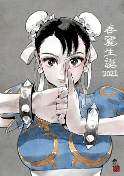 1girl 2021 ahn_dongshik birthday blue_dress bracelet bun_cover capcom character_name china_dress chinese_clothes chun-li commentary_request double_bun dress earrings eyelashes eyeliner fingernails fist_in_hand grey_background hair_bun hair_ribbon hatching_(texture) highres jewelry light_smile linear_hatching looking_at_viewer loose_hair_strand makeup mandarin_collar pankou puffy_short_sleeves puffy_sleeves red_eyeliner red_lips ribbon seal_impression seal_script shanghai_neckline short_hair short_sleeves simple_background solo spiked_bracelet spikes straight-on street_fighter street_fighter_ii_(series) upper_body waistband