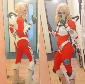 1girl absurdres alternate_costume armor blonde_hair bodysuit boots cellphone cosplay f-zero f-zero_x full_body highres indoors long_hair mirror monkii_(mjooolnina) mrs._arrow muscular muscular_female nintendo phone real_life red_lips redesign selfie sketch smartphone solo standing sunglasses