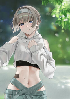 1girl absurdres bandaid_on_stomach bare_shoulders black_sports_bra blue_eyes breasts clothing_cutout commentary cowboy_shot cropped_hoodie drawstring goddess_of_victory:_nikke green_pants grey_hair hair_between_eyes hand_on_own_chest headband highres hood hood_down hoodie kraben long_sleeves looking_at_viewer medium_breasts midriff mole mole_on_stomach navel outdoors pants prika_(cool_paprika)_(nikke) prika_(nikke) short_hair shoulder_cutout sidelocks smile solo sports_bra standing sweat tied_drawstring white_headband