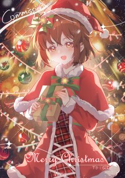 1girl :d bow bowtie box brown_eyes brown_hair capelet christmas christmas_tree commission cowboy_shot dress fingernails fur-trimmed_capelet fur-trimmed_dress fur_trim gift gift_box hagiwara_yukiho hair_bow hat highres holding holding_gift idolmaster idolmaster_(classic) long_sleeves looking_at_viewer merry_christmas open_mouth red_capelet red_dress red_hat santa_costume santa_hat short_hair smile snowflakes solo standing watermark wing_(39_miku831)