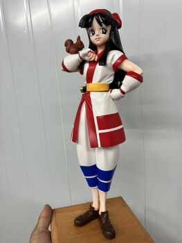 Rule 34 | 1girl, ainu clothes, black eyes, black hair, breasts, figure, fingerless gloves, gloves, hair ribbon, hand on own hip, highres, legs, long hair, nakoruru, pants, ribbon, samurai spirits, small breasts, smile, snk, solo, squirrel, the king of fighters, thighs, weapon