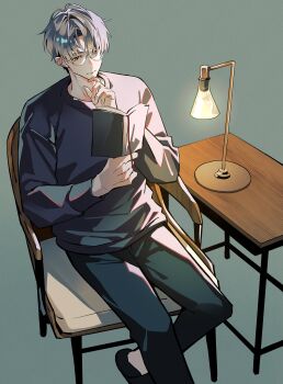 1boy absurdres aose_(_aose242) black_pants black_slippers book brown_eyes chair closed_mouth curtained_hair desk_lamp foot_out_of_frame from_above glasses grey-framed_eyewear grey_background grey_hair grey_sweater hand_on_own_chin highres hitotsubashi_ayato hitotsubashi_ayato_(2nd_costume) holding holding_book lamp long_sleeves male_focus nijisanji on_chair pants reading short_hair sidelighting simple_background sitting slippers solo sweater table undercut virtual_youtuber