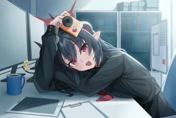 1girl :d black_hair black_horns black_shirt blue_archive camera chiaki_(blue_archive) coffee coffee_mug computer cup doodle_sensei_(blue_archive) dot_nose doumu_(31678316) halo head_rest highres holding holding_camera horns indoors leaning_on_table long_hair long_sleeves looking_at_viewer mug necktie open_mouth pointy_ears red_eyes red_halo red_necktie sensei_(blue_archive) shelf shirt smile solo sticky_note table